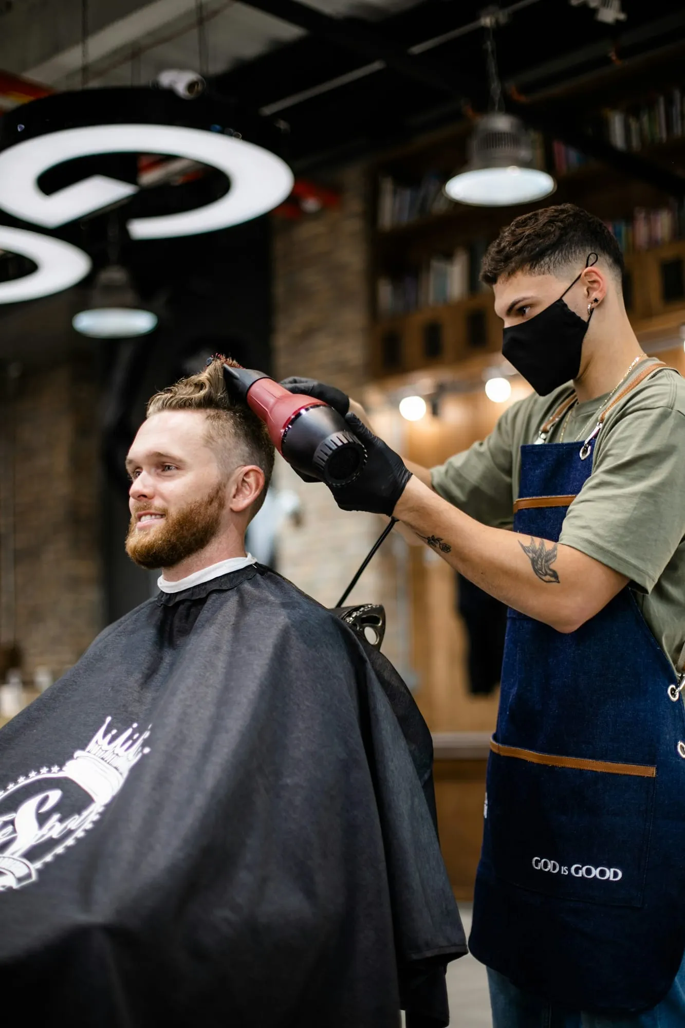 Client smiling during a blow-dry