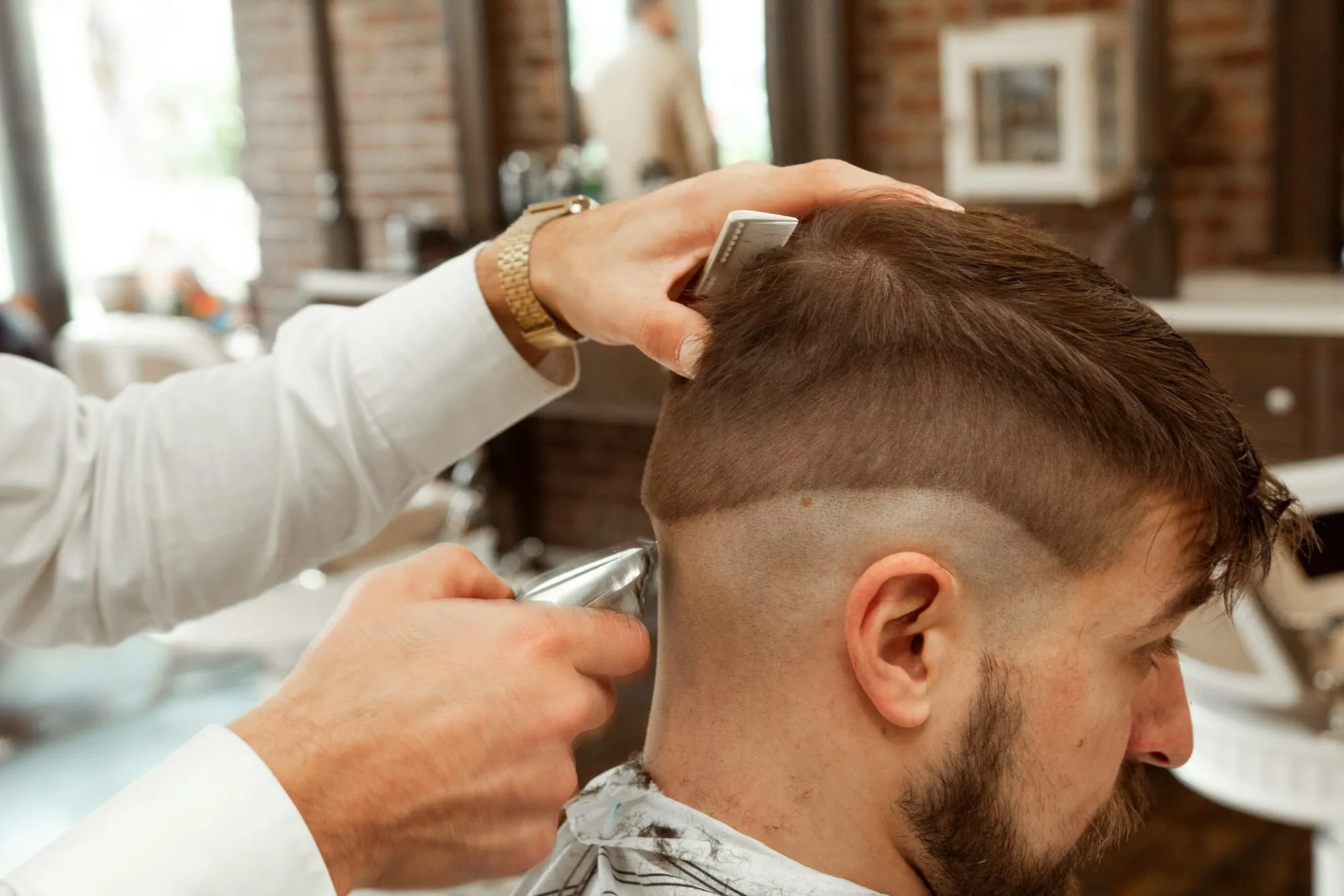Barber cutting a textured crop with clippers