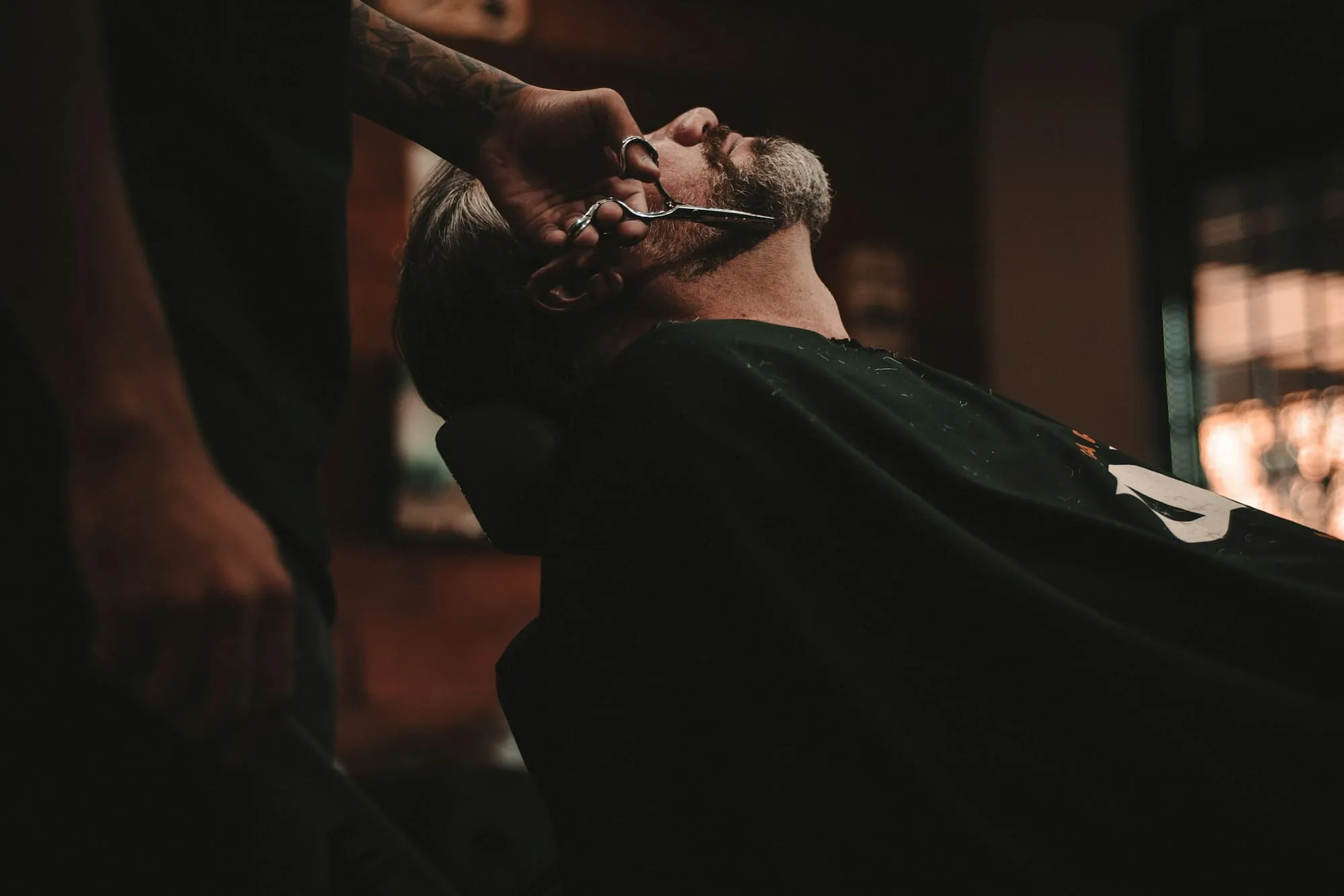 Client reclined for a beard trim